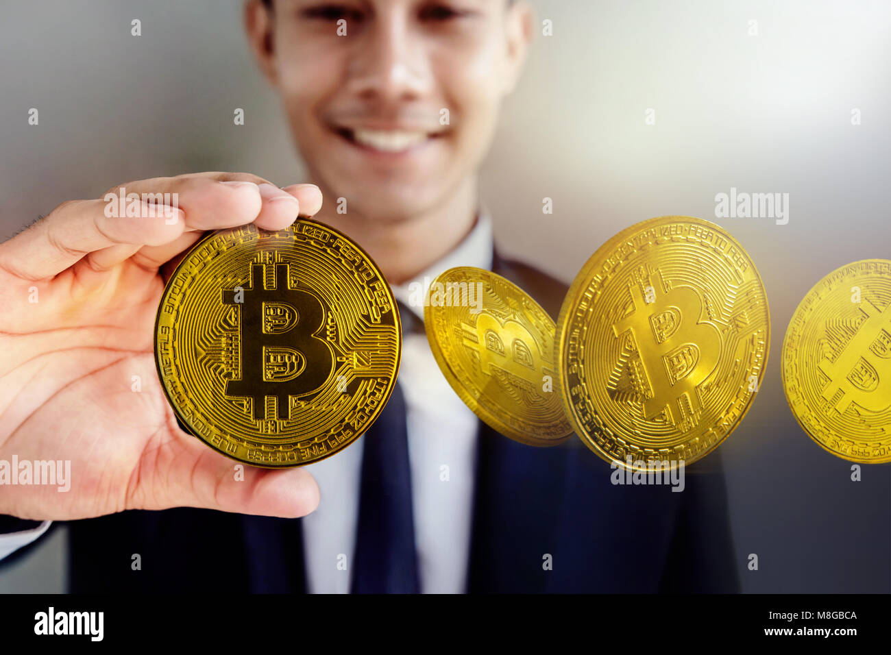 Smiling Businessman Hol!   ding Golden Bitcoin Money Happy To Earn And - 